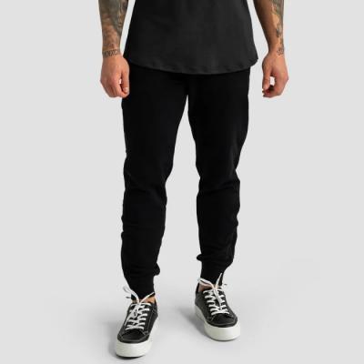 GymBeam Tepláky Limitless Black MM